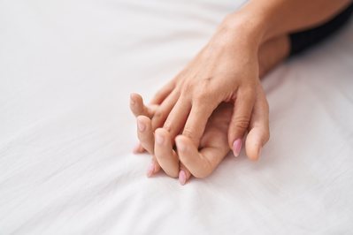 man and woman in bed together