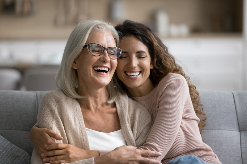 mom and daughter laughing